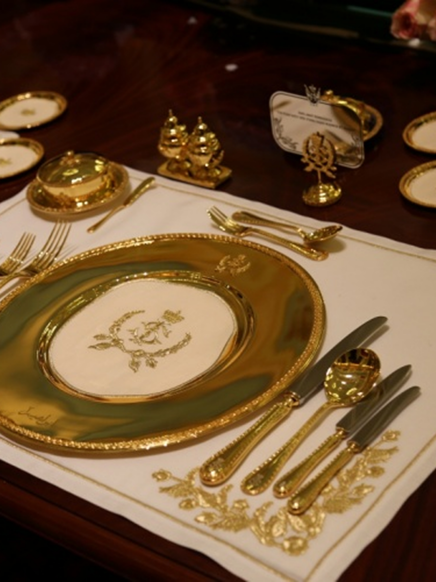 Bespoke Banquetware Sterling silver chargers, flatware; and linens.